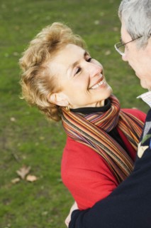 Senior couple smiling at each other outdoors