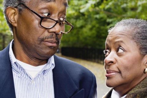Close up of senior African couple looking at each other outdoors