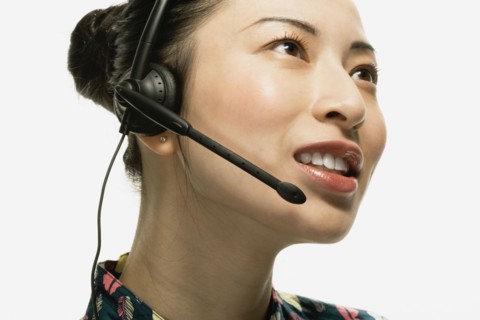 Studio shot of Asian woman wearing headset