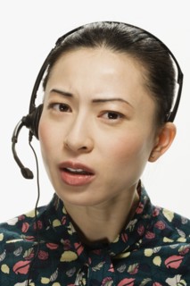 Studio shot of Asian woman wearing headset