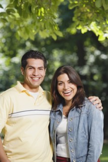 Young Hispanic couple smiling outdoors