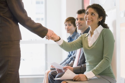 Young businesswoman shaking hands