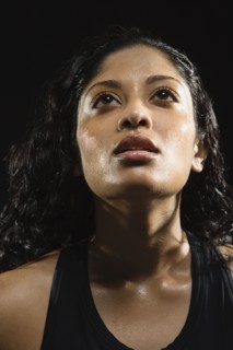Sweaty Indian woman in athletic gear