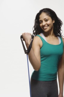 Indian woman using exercise band