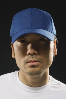 Asian man wearing baseball hat