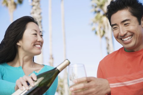 Asian couple drinking wine