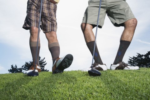 Multi-ethnic men on golf course