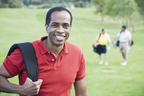 African man on golf course