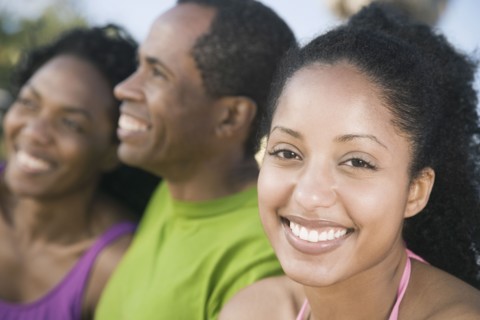 African woman with family in background
