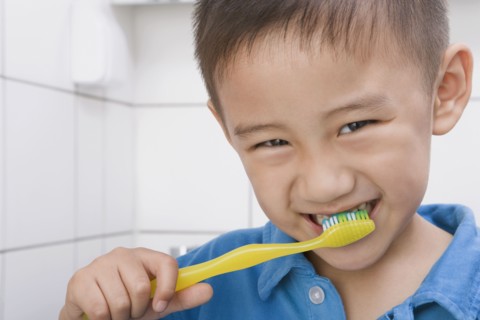 Chinese boy brushing teeth