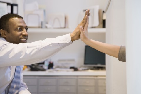Business people high-fiving
