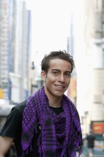 Hispanic man smiling on urban street