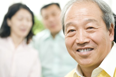 Smiling Chinese man with family