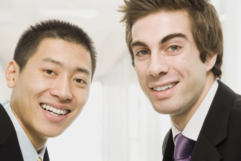 Businessmen smiling
