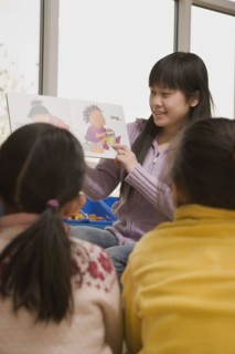 Chinese woman reading to children