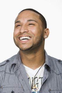 Hispanic man looking up and laughing