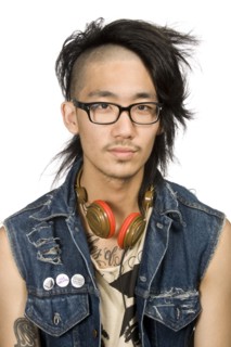Asian man with headphones looking serious