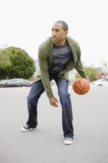 African American man playing basketball