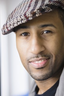 African American man wearing cap