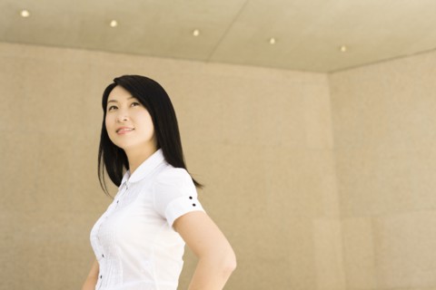Smiling Chinese businesswoman in office