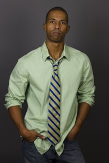Serious African American man wearing shirt and tie