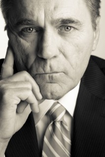 Serious Caucasian businessman with head in hands