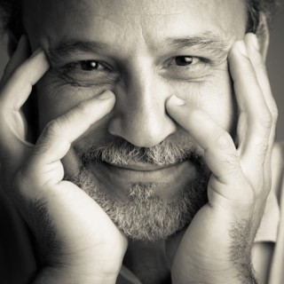 Middle Eastern man with head in hands