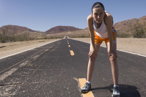 Mixed Race female runner on road
