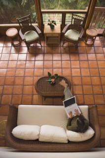High angle view of woman using laptop on sofa