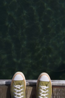 Sneakers on dock over water