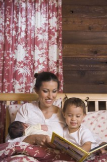 Hispanic mother reading to daughter