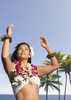 Pacific Islander woman in lei dancing