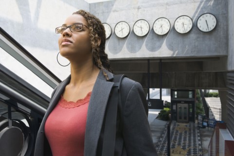 African businesswoman in train station