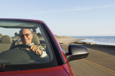 Senior German man driving convertible car