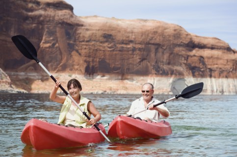 Multi-ethnic senior couple kayaking