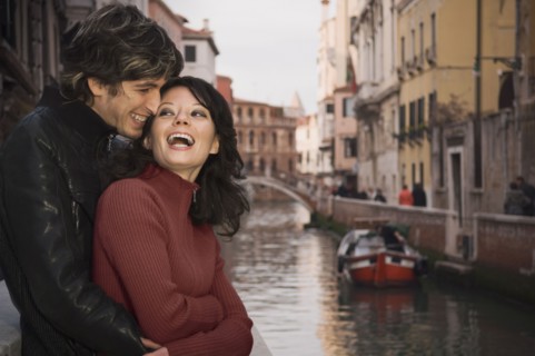 Italian couple hugging near canal