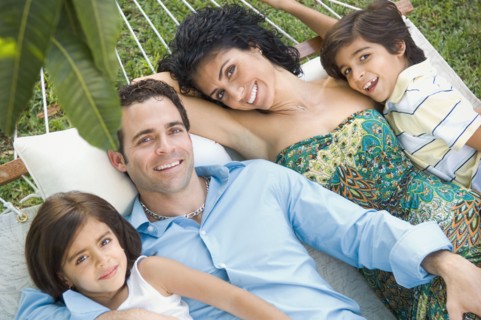 Family relaxing in hammock