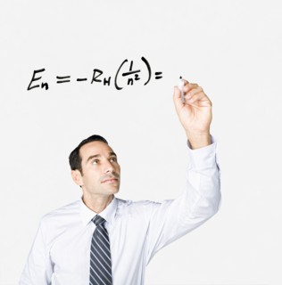 Hispanic businessman writing formula on clear board