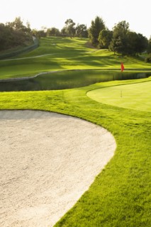 Sand trap and pond on golf course