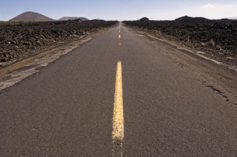 Highway through barren landscape