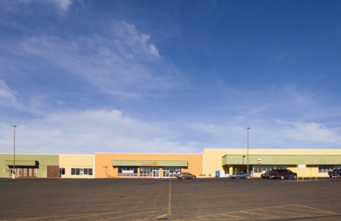 Empty parking lot in strip mall