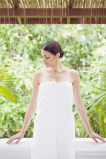 Caucasian woman in spa wrapped in a towel