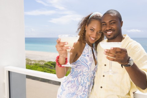 Couple having drinks on balcony