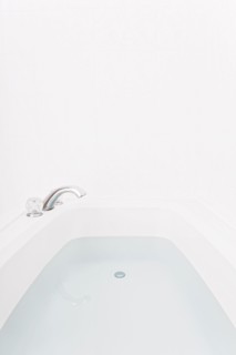 Faucet over full bathtub