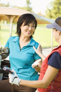 Women talking on golf course