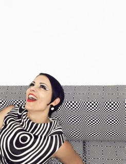 Laughing woman wearing retro patterned dress