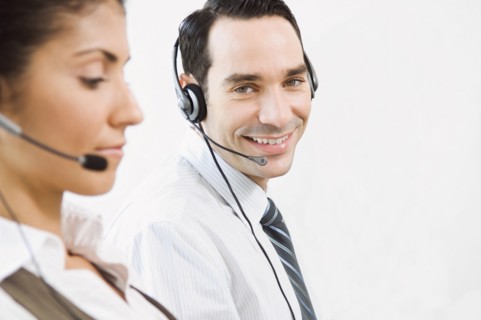 Customer service representatives wearing headsets