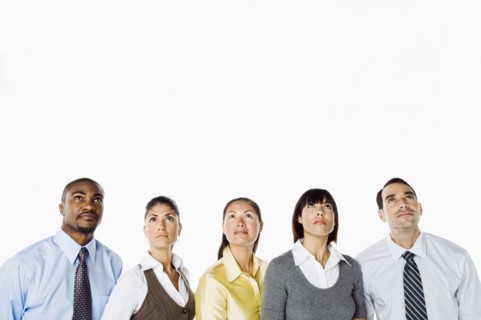 Portrait of curious business people looking up