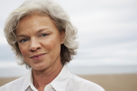 Caucasian woman standing on beach