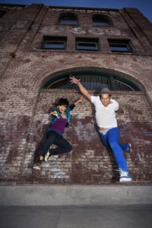 Couple breakdancing in urban area